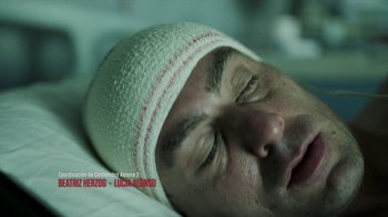 Movie still from “Money Heist” (2017), created by Álex Pina – A person wearing a hat on their head; Extreme Close Up shot, Overhead angle