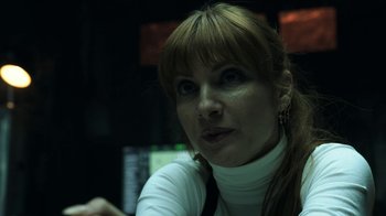 Movie still from “Money Heist” (2017), created by Álex Pina – A person wearing a white shirt; Close Up shot, Low angle