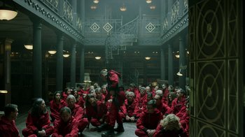 Movie still from “Money Heist” (2017), created by Álex Pina – A large group of people in a room; Wide shot, High angle