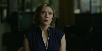 Movie still from “Love & Death” (2023), directed by Clark Johnson – A person looking up at the sky; Close Up shot, Over the shoulder angle