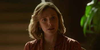 Movie still from “Love & Death” (2023), directed by Clark Johnson – A person wearing a red shirt; Close Up shot, Over the shoulder angle