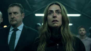 Movie still from “Money Heist” (2017), created by Álex Pina – A woman with long brown hair looking up at the sky; Close Up shot, Low angle