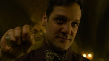 Movie still from “Money Heist” (2017), created by Álex Pina – A person wearing a bow tie; Close Up shot, Low angle