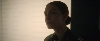 Movie still from “Monster” (2022), directed by Clement Virgo – A woman in military uniform is looking at the camera; Close Up shot, Low angle