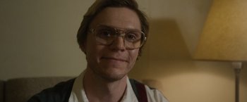 Movie still from “Monster” (2022), directed by Clement Virgo – A person wearing glasses; Close Up shot, Low angle