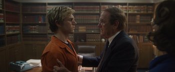 Movie still from “Monster” (2022), directed by Clement Virgo – A man and a woman in an office talking; Medium shot, Over the shoulder angle