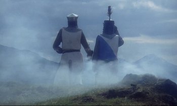 Movie still from “Monty Python and the Holy Grail” (1975), directed by Terry Gilliam – Two people dressed as knights standing in the fog; Wide shot, Low angle