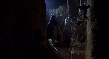 Movie still from “Life of Brian” (1979), directed by Terry Jones – Many statues in this cave; Wide shot, Low angle