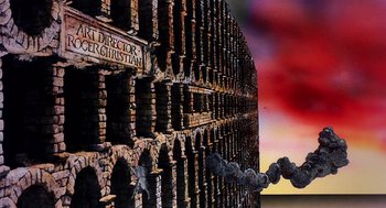 Movie still from “Life of Brian” (1979), directed by Terry Jones – A brick wall with a chain hanging from it's side; Extreme Wide shot, Low angle