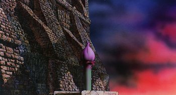 Movie still from “Life of Brian” (1979), directed by Terry Jones – An artistic rendering of a candle in front of a stone wall; Extreme Wide shot, Low angle