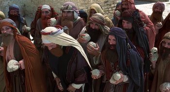 Movie still from “Life of Brian” (1979), directed by Terry Jones – A group of people dressed in biblical clothing; Close Up shot, High angle