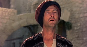 Movie still from “Life of Brian” (1979), directed by Terry Jones – A person wearing a turban; Close Up shot, Low angle
