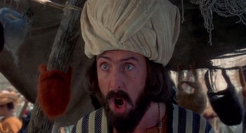Movie still from “Life of Brian” (1979), directed by Terry Jones – A man with a beard wearing a turban; Close Up shot, Low angle
