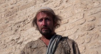 Movie still from “Life of Brian” (1979), directed by Terry Jones – A man with a beard wearing a hat; Close Up shot, Low angle