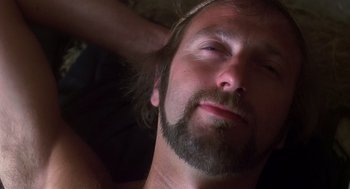 Movie still from “Life of Brian” (1979), directed by Terry Jones – A man with a beard and a mustache; Close Up shot, Overhead angle