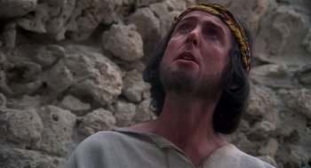 Movie still from “Life of Brian” (1979), directed by Terry Jones – A statue of a man wearing a crown; Close Up shot, Low angle