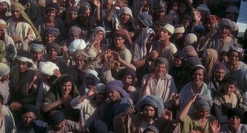 Movie still from “Life of Brian” (1979), directed by Terry Jones – A large group of people in a crowd; Wide shot, High angle