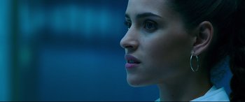 Movie still from “Morbius” (2022), directed by Daniel Espinosa – A woman's face in the dark; Close Up shot, Low angle