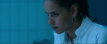 Movie still from “Morbius” (2022), directed by Daniel Espinosa – A person wearing a white shirt; Close Up shot, Over the shoulder angle