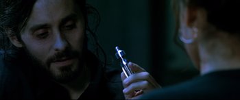 Movie still from “Morbius” (2022), directed by Daniel Espinosa – A man holding an electronic cigarette in his hand; Close Up shot, High angle