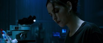 Movie still from “Morbius” (2022), directed by Daniel Espinosa – A young woman with her eyes closed in a dark room; Close Up shot, Low angle