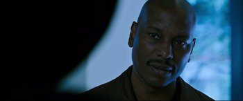 Movie still from “Morbius” (2022), directed by Daniel Espinosa – A man's face in front of a blue background; Close Up shot, Low angle