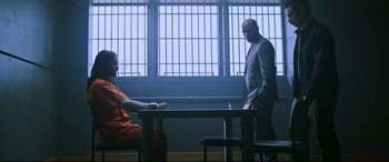 Movie still from “Morbius” (2022), directed by Daniel Espinosa – Two men in a room with a table and chairs; Wide shot, Over the shoulder angle