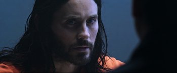 Movie still from “Morbius” (2022), directed by Daniel Espinosa – A person with long hair; Close Up shot, Over the shoulder angle