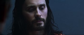 Movie still from “Morbius” (2022), directed by Daniel Espinosa – A person with long hair; Close Up shot, Low angle