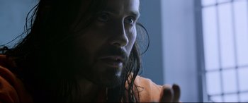 Movie still from “Morbius” (2022), directed by Daniel Espinosa – A person with long hair; Close Up shot, Over the shoulder angle