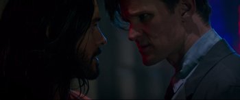 Movie still from “Morbius” (2022), directed by Daniel Espinosa – Two men face to face in a dark room; Close Up shot, Over the shoulder angle