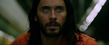Movie still from “Morbius” (2022), directed by Daniel Espinosa – A person with long black hair; Close Up shot, High angle