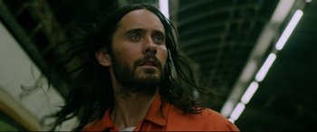 Movie still from “Morbius” (2022), directed by Daniel Espinosa – A man with long black hair looking up; Close Up shot, Low angle