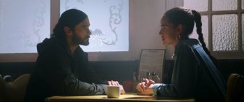 Movie still from “Morbius” (2022), directed by Daniel Espinosa – A man and a woman sitting in front of a computer; Medium shot, Over the shoulder angle