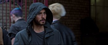 Movie still from “Morbius” (2022), directed by Daniel Espinosa – A person wearing a hooded jacket; Close Up shot, Over the shoulder angle