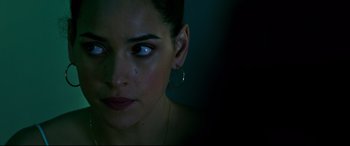 Movie still from “Morbius” (2022), directed by Daniel Espinosa – A person wearing a earring; Close Up shot, Over the shoulder angle