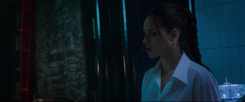 Movie still from “Morbius” (2022), directed by Daniel Espinosa – A woman in a white shirt looking out of a window; Close Up shot, Over the shoulder angle