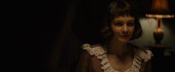 Movie still from “Mudbound” (2017), directed by Dee Rees – A woman in a white dress is posing for a picture; Close Up shot, Over the shoulder angle