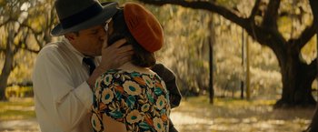 Movie still from “Mudbound” (2017), directed by Dee Rees – A man and a woman kissing in a park; Close Up shot, Over the shoulder angle