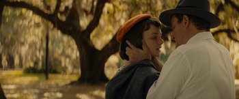 Movie still from “Mudbound” (2017), directed by Dee Rees – A woman in a red hat is holding her hair; Close Up shot, Over the shoulder angle