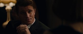 Movie still from “Mudbound” (2017), directed by Dee Rees – A person wearing a suit and tie; Close Up shot, Over the shoulder angle