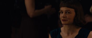 Movie still from “Mudbound” (2017), directed by Dee Rees – A woman in a blue dress looking at the camera; Close Up shot, Over the shoulder angle