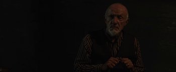 Movie still from “Mudbound” (2017), directed by Dee Rees – An older man in a striped shirt and vest; Close Up shot, Low angle