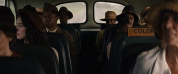 Movie still from “Mudbound” (2017), directed by Dee Rees – A group of men sitting on a bus; Medium shot, Over the shoulder angle