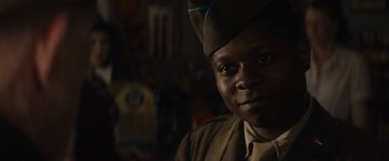 Movie still from “Mudbound” (2017), directed by Dee Rees – A man wearing a military uniform and a hat; Close Up shot, Over the shoulder angle