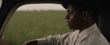 Movie still from “Mudbound” (2017), directed by Dee Rees – A man sitting in the driver's seat of a car; Close Up shot, Over the shoulder angle