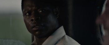 Movie still from “Mudbound” (2017), directed by Dee Rees – A person wearing a white dress shirt; Close Up shot, Over the shoulder angle