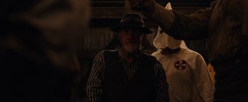 Movie still from “Mudbound” (2017), directed by Dee Rees – An old man wearing a hat and a striped shirt; Medium shot, Over the shoulder angle