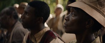 Movie still from “Mudbound” (2017), directed by Dee Rees – A man with a hat looking into the distance; Close Up shot, Over the shoulder angle