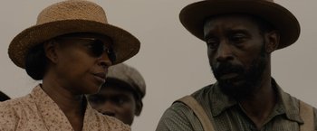 Movie still from “Mudbound” (2017), directed by Dee Rees – A group of men standing next to each other; Close Up shot, Over the shoulder angle